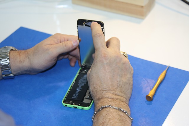 man repairing phone
